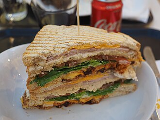 Fast foods, crispy chicken, bacon, and tomato club sandwich, with cheese, lettuce, and mayonnaise