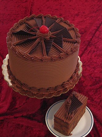 Cake or cupcake, white with chocolate icing, bakery